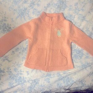 Pink halfway zip up sweater with angel and angel wings on back
